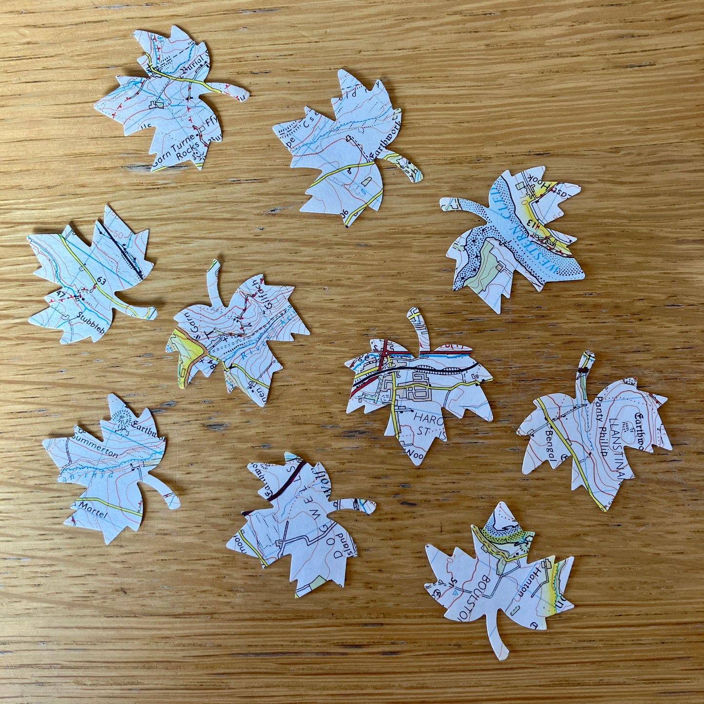 Welsh map die cut leaf embellishments on recycled paper ~ 50
