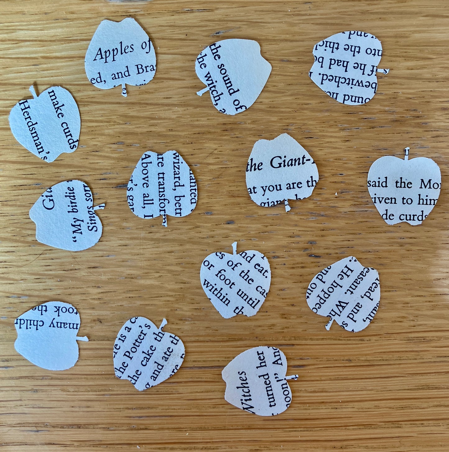 Apple embellishments on recycled folk tale book paper - 100 x die cut apples
